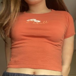 orange baby tee